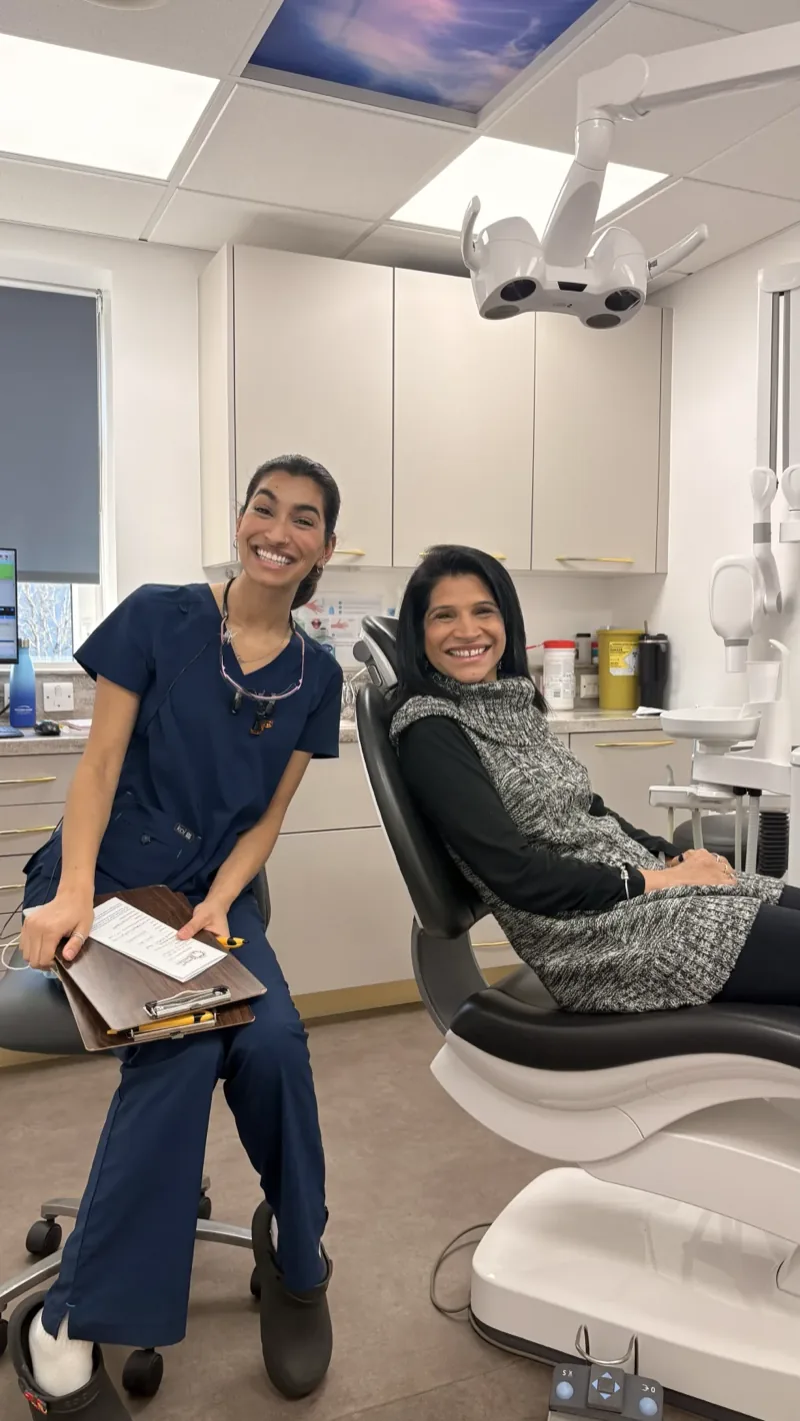 Dr Deesha with a smiling patient in the treatment chair at Smart Smiles